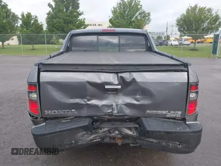 2014 Honda Ridgeline RTL with VIN 5FPYK1F5XEB011772, listed as a IAAI auction lot 42440390 with 145,219 mi miles and . Bid and sale history available at DreamBid. Image 16.