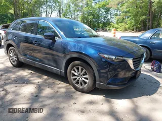 2019 Mazda CX-9 Touring z VIN JM3TCBCYXK0327470, wystawiony jako IAAI lot #42402708 z przebiegiem 75 642 mil mil oraz . Historia ofert i sprzedaży dostępna na DreamBid. Obrazek 1.