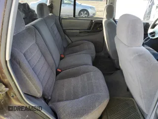 1997 Jeep Grand Cherokee Laredo with VIN 1J4GZ58S9VC687969, listed as a Copart auction lot 79930814 with 0 mi miles and Salvage Title. Bid and sale history available at carsss.com. Image 11.