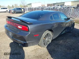 2013 Dodge Charger SXT with VIN 2C3CDXHG3DH593614, listed as a IAAI auction lot 42138282 with 174,243 mi miles. Bid and sale history available at carsss.com. Image 4.
