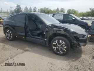2023 Ford Mustang Mach-E Premium with VIN 3FMTK3SUXPMA74148, listed as a Copart auction lot 54856295 with 5,469 mi miles and Salvage Title. Bid and sale history available at DreamBid. Image 4.