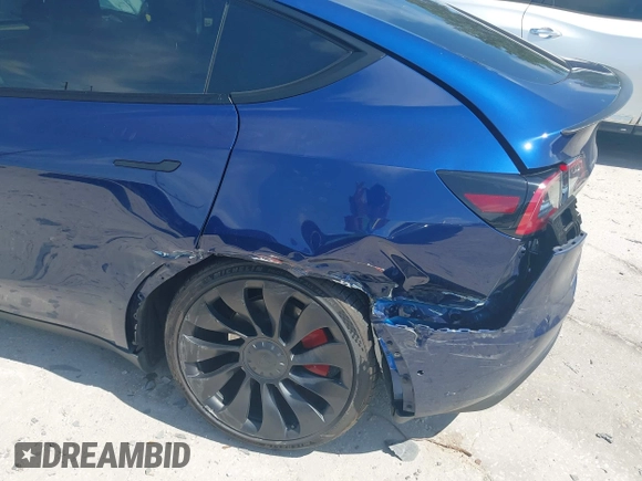2023 Tesla Model Y Performance with VIN 7SAYGDEF9PF582908, listed as a IAAI auction lot 41930957 with 52,857 mi miles and . Bid and sale history available at DreamBid. Image 6.