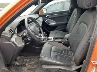 2021 Audi Q3 Premium with VIN WA1AUCF36M1060404, listed as a Copart auction lot 56501285 with 66,594 mi miles and Salvage title. Bid and sale history available at DreamBid. Image 7.