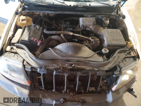 2004 Jeep Grand Cherokee Laredo z VIN 1J4GW48S74C165732, wystawiony jako Copart lot #56316885 z przebiegiem 177 139 mil mil oraz Szkoda całkowita • Salvage title. Historia ofert i sprzedaży dostępna na DreamBid. Obrazek 12.