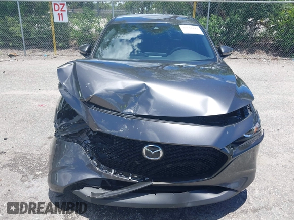 2022 Mazda 3 Select z VIN JM1BPAKL1N1519383, wystawiony jako IAAI lot #39742243 z przebiegiem 20 080 mil mil oraz . Historia ofert i sprzedaży dostępna na DreamBid. Obrazek 12.