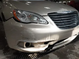 2014 Chrysler 200 Touring with VIN 1C3CCBBB8EN107990, listed as a IAAI auction lot 41878376 with 137,424 mi miles. Bid and sale history available at carsss.com. Image 12.