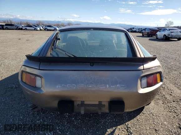 1984 Porsche 928 z VIN WP0JB0920ES860222, wystawiony jako Copart lot #44055645 z przebiegiem 166 689 mil mil oraz Nie do naprawy. Historia ofert i sprzedaży dostępna na DreamBid. Obrazek 6.