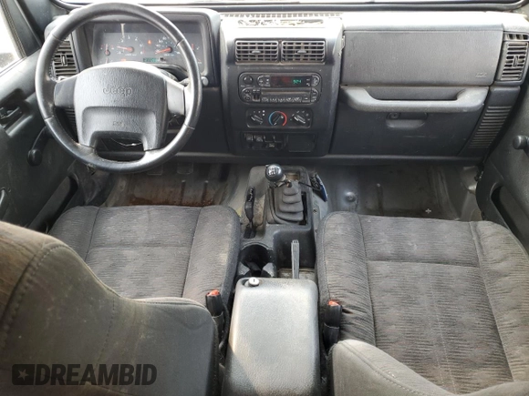 2003 Jeep Wrangler Sport z VIN 1J4FA49S93P306817, wystawiony jako Copart lot #60136385 z przebiegiem 217 208 mil mil oraz Czysty tytuł • Clean title. Historia ofert i sprzedaży dostępna na DreamBid. Obrazek 8.