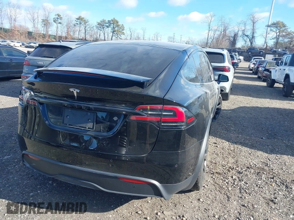 2023 Tesla Model X with VIN 7SAXCAE59PF377408, listed as a IAAI auction lot 41176738 with 32,496 mi miles and . Bid and sale history available at DreamBid. Image 4.