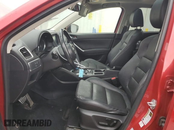 2016 Mazda CX-5 Grand Touring with VIN JM3KE4DY5G0660201, listed as a Copart auction lot 52165205 with 108,231 mi miles and Salvage Title. Bid and sale history available at DreamBid. Image 7.