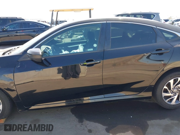 2018 Honda Civic EX with VIN 19XFC2F74JE021802, listed as a IAAI auction lot 42031745 with 102,986 mi miles and . Bid and sale history available at DreamBid. Image 13.