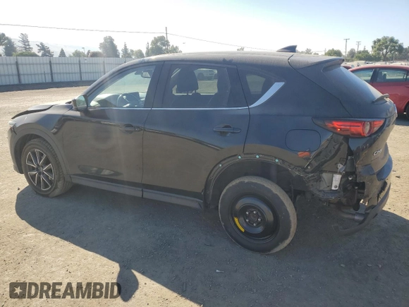 2018 Mazda CX-5 Grand Touring с VIN JM3KFADM2J1310339, выставлен на аукционе Copart как лот 64705245 с пробегом 63 927 миль миль и Списание • Salvage title. История ставок и продаж доступна на DreamBid. Изображение 2.