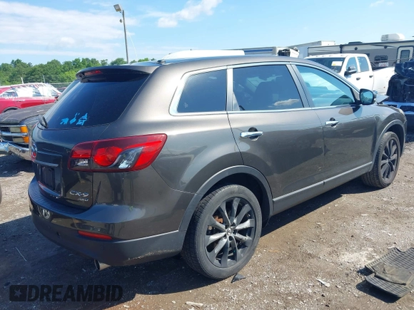 2015 Mazda CX-9 Grand Touring z VIN JM3TB3DV8F0465155, wystawiony jako IAAI lot #42366636 z przebiegiem 125 407 mil mil oraz . Historia ofert i sprzedaży dostępna na DreamBid. Obrazek 4.