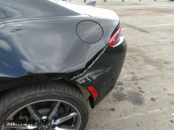 2021 Mazda MX-5 Miata Grand Touring z VIN JM1NDAM75M0451597, wystawiony jako IAAI lot #41932712 z przebiegiem 61 710 mil mil oraz . Historia ofert i sprzedaży dostępna na DreamBid. Obrazek 19.