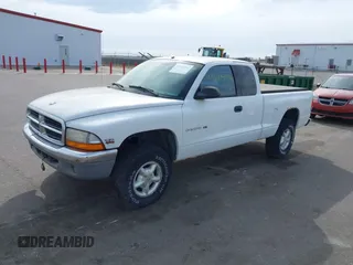 1998 Dodge Dakota SLT with VIN 1B7GG22X8WS677553, listed as a IAAI auction lot 41854961 with 167,917 mi miles and . Bid and sale history available at carsss.com. Image 2.