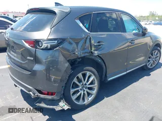 2018 Mazda CX-5 Grand Touring with VIN JM3KFADM8J1310328, listed as a IAAI auction lot 42322780 with 106,378 mi miles and . Bid and sale history available at DreamBid. Image 4.