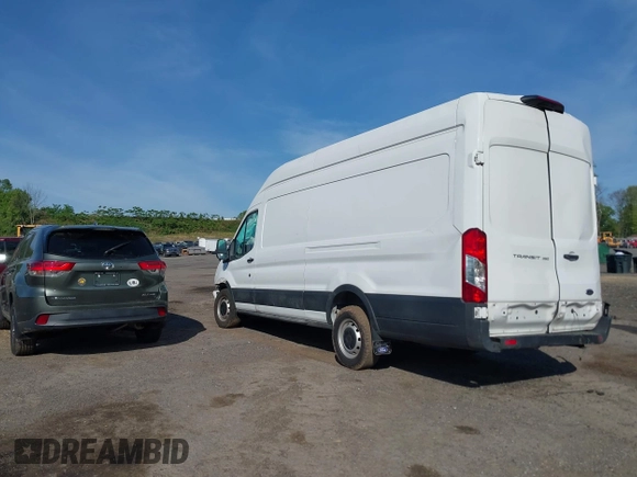 2021 Ford Transit Cargo z VIN 1FTBW3X84MKA60720, wystawiony jako IAAI lot #42202665 z przebiegiem 67 295 mil mil oraz . Historia ofert i sprzedaży dostępna na DreamBid. Obrazek 3.