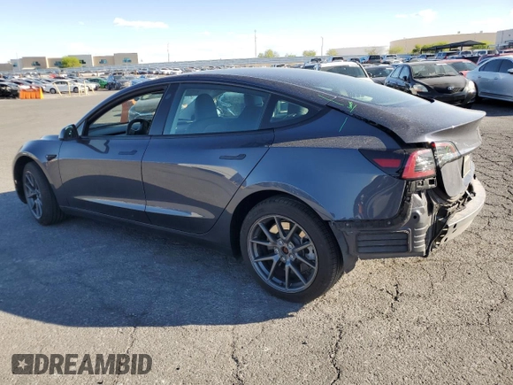 2023 Tesla Model 3 with VIN 5YJ3E1EA4PF556782, listed as a Copart auction lot 55626935 with 26,615 mi miles and Salvage title. Bid and sale history available at DreamBid. Image 2.