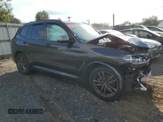 2019 BMW X3 M40i with VIN 5UXTS3C59K0Z06102, listed as a Copart auction lot 74219704 with Not Provided miles and Salvage Title. Bid and sale history available at DreamBid. Image 4.