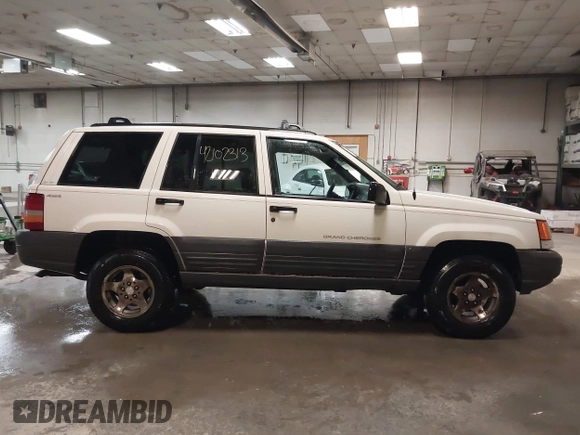 1997 Jeep Grand Cherokee Laredo z VIN 1J4GZ58S9VC562907, wystawiony jako IAAI lot #42102313 z przebiegiem 137 672 mil mil oraz . Historia ofert i sprzedaży dostępna na DreamBid. Obrazek 13.