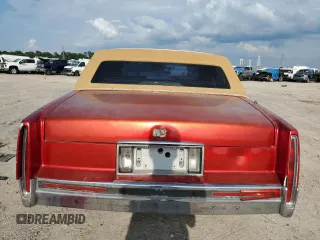 1991 Cadillac DeVille z VIN 1G6CD53B2M4335645, wystawiony jako Copart lot #53390805 z przebiegiem 210 451 mil mil oraz Szkoda całkowita • Salvage title. Historia ofert i sprzedaży dostępna na DreamBid. Obrazek 6.