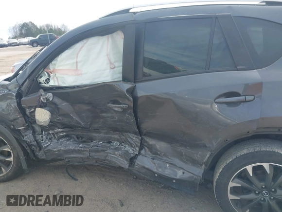 2016 Mazda CX-5 Grand Touring with VIN JM3KE4DY9G0845707, listed as a IAAI auction lot 41709685 with 96,351 mi miles. Bid and sale history available at carsss.com. Image 14.