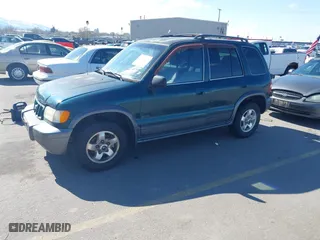 2002 Kia Sportage with VIN KNDJA723925120001, listed as a IAAI auction lot 41931419 with 145,675 mi miles. Bid and sale history available at carsss.com. Image 2.