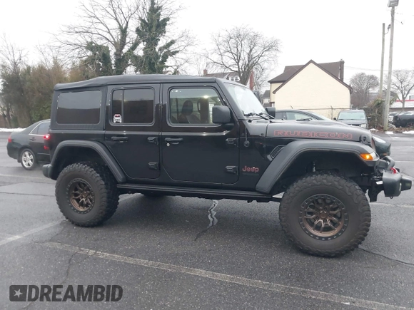 2022 Jeep Wrangler Unlimited Rubicon with VIN 1C4HJXFGXNW127064, listed as a IAAI auction lot 41491203 with 47,700 mi miles and . Bid and sale history available at DreamBid. Image 6.