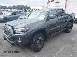 2021 Toyota Tacoma SR z VIN 3TMCZ5AN9MM397611, wystawiony jako IAAI lot #41467705 z przebiegiem 65 191 mil mil oraz . Historia ofert i sprzedaży dostępna na DreamBid. Obrazek 2.
