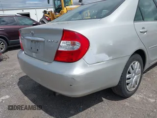 2003 Toyota Camry LE z VIN 4T1BE32K93U260416, wystawiony jako IAAI lot #42300847 z przebiegiem 110 918 mil mil oraz . Historia ofert i sprzedaży dostępna na DreamBid. Obrazek 12.