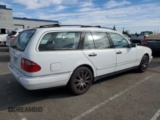 1999 Mercedes-Benz E-Class with VIN WDBJH65F3XA749696, listed as a Copart auction lot 77656084 with 163,802 mi miles and Salvage Title. Bid and sale history available at carsss.com. Image 3.