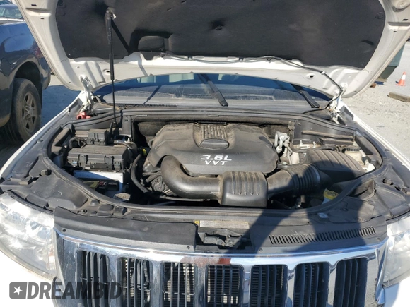 2012 Jeep Grand Cherokee Laredo with VIN 1C4RJFAG0CC201435, listed as a Copart auction lot 47026885 with 205,603 mi miles and Salvage Title. Bid and sale history available at carsss.com. Image 12.