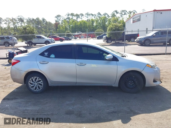 2018 Toyota Corolla L with VIN 5YFBURHEXJP810003, listed as a IAAI auction lot 42526648 with 84,546 mi miles and . Bid and sale history available at DreamBid. Image 14.