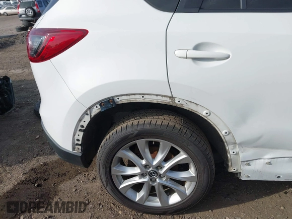 2014 Mazda CX-5 Grand Touring with VIN JM3KE4DY7E0425201, listed as a IAAI auction lot 41803597 with 118,867 mi miles. Bid and sale history available at carsss.com. Image 12.