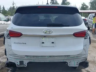 2020 Hyundai Santa Fe SE with VIN 5NMS23AD1LH192085, listed as a IAAI auction lot 42455451 with 50,517 mi miles and . Bid and sale history available at DreamBid. Image 17.