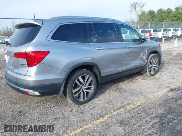 2016 Honda Pilot Touring with VIN 5FNYF6H90GB024902, listed as a IAAI auction lot 41948563 with 148,598 mi miles. Bid and sale history available at carsss.com. Image 4.