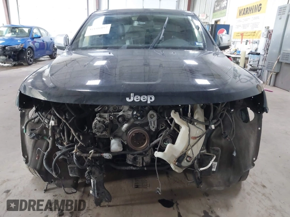 2013 Jeep Grand Cherokee Overland with VIN 1C4RJFCT7DC524005, listed as a IAAI auction lot 42116097 with 126,942 mi miles. Bid and sale history available at carsss.com. Image 12.