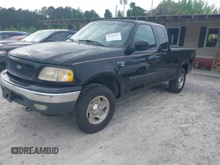 2000 Ford F-150 XL with VIN 1FTRX18LXYNB58643, listed as a IAAI auction lot 42100553 with 382,492 mi miles. Bid and sale history available at carsss.com. Image 2.