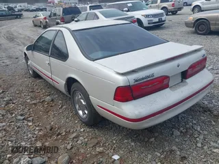 1997 Ford Thunderbird LX with VIN 1FALP62W6VH142784, listed as a IAAI auction lot 41792883 with 244,300 mi miles. Bid and sale history available at carsss.com. Image 3.