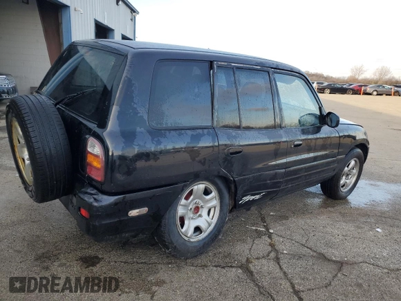 1999 Toyota RAV4 with VIN JT3GP10V9X7042801, listed as a Copart auction lot 82712874 with 256,151 mi miles and Salvage Title. Bid and sale history available at DreamBid. Image 3.