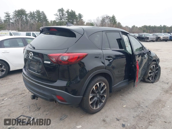 2016 Mazda CX-5 Grand Touring with VIN JM3KE4DY1G0685449, listed as a IAAI auction lot 41162840 with 134,525 mi miles. Bid and sale history available at carsss.com. Image 4.