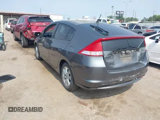 2010 Honda Insight EX with VIN JHMZE2H71AS043465, listed as a IAAI auction lot 42312556 with 151,009 mi miles and . Bid and sale history available at DreamBid. Image 3.