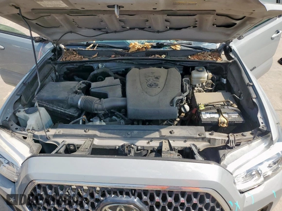 2019 Toyota Tacoma SR z VIN 5TFCZ5AN6KX211952, wystawiony jako Copart lot #58964815 z przebiegiem 97 774 mil mil oraz Szkoda całkowita • Salvage title. Historia ofert i sprzedaży dostępna na DreamBid. Obrazek 11.