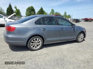 2013 Volkswagen Jetta SE with VIN 3VWDP7AJXDM281723, listed as a Copart auction lot 57235725 with 128,157 mi miles and Salvage title. Bid and sale history available at DreamBid. Image 3.