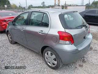 2010 Toyota Yaris with VIN JTDKT4K38A5296999, listed as a IAAI auction lot 41878127 with 122,692 mi miles. Bid and sale history available at carsss.com. Image 3.