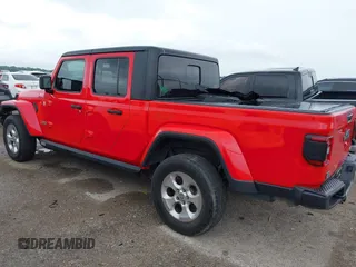 2020 Jeep Gladiator Overland with VIN 1C6HJTFG2LL136758, listed as a IAAI auction lot 42414592 with 57,279 mi miles and . Bid and sale history available at DreamBid. Image 3.