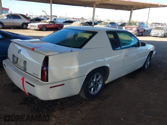 2002 Cadillac Eldorado z VIN 1G6EC12922B106670, wystawiony jako IAAI lot #41648782 z przebiegiem 174 320 mil mil oraz . Historia ofert i sprzedaży dostępna na DreamBid. Obrazek 4.