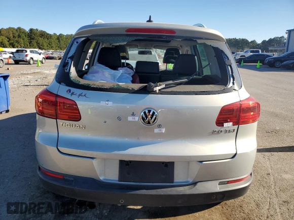 2014 Volkswagen Tiguan SE with VIN WVGAV3AX9EW611860, listed as a Copart auction lot 74431754 with 116,022 mi miles and Salvage title. Bid and sale history available at DreamBid. Image 6.