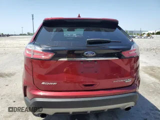 2019 Ford Edge Titanium z VIN 2FMPK3K91KBB99949, wystawiony jako Copart lot #57023225 z przebiegiem 103 876 mil mil oraz Nie do naprawy. Historia ofert i sprzedaży dostępna na DreamBid. Obrazek 6.