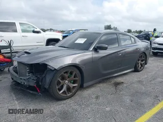 2019 Dodge Charger GT with VIN 2C3CDXHG6KH628451, listed as a IAAI auction lot 40750593 with 80,996 mi miles and . Bid and sale history available at DreamBid. Image 2.